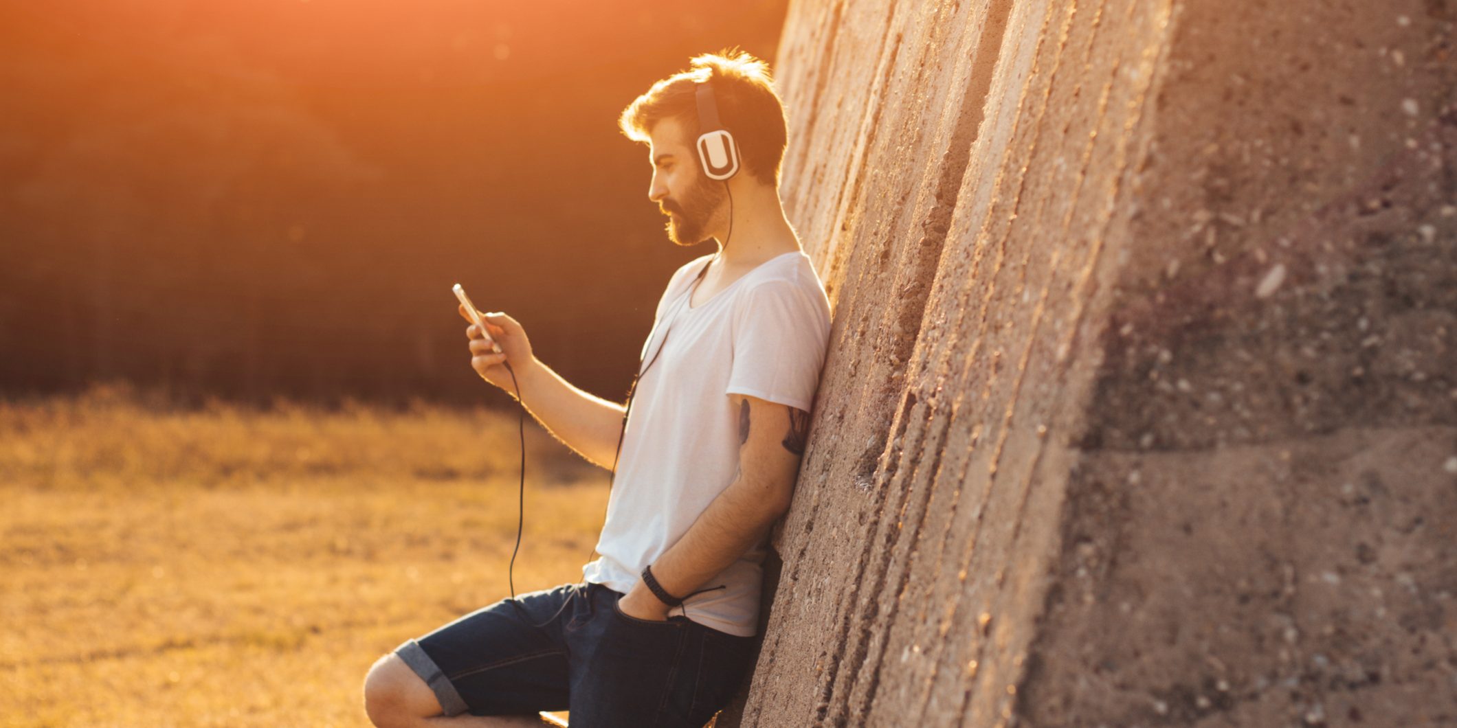 Hipster guy listening to music