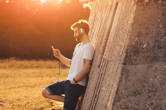 Hipster guy listening to music