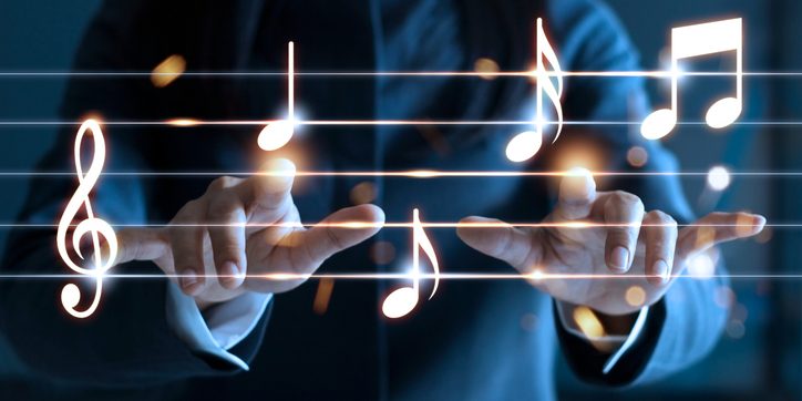 Woman hands playing music notes on dark background, music concept